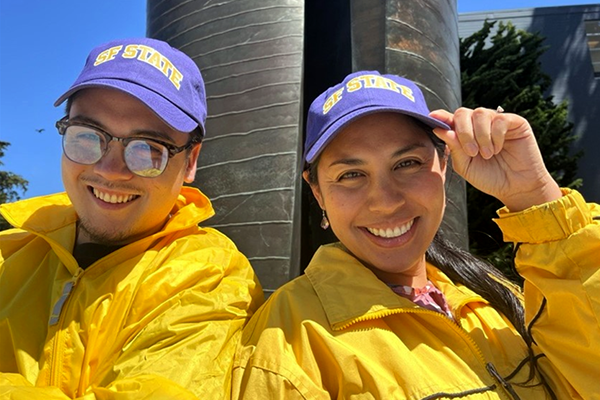 Commencement ambassadors wearing SF State cap and jacket
