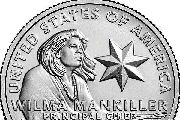A silver coin with the likeness of Wilma Mankiller