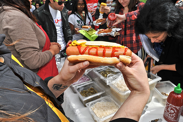 a hot dog with ketchup spelling out "Vote!"