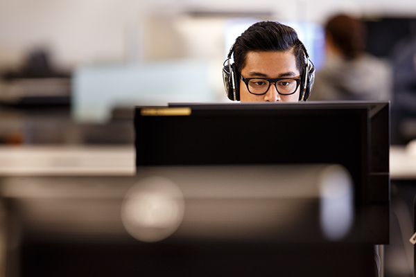 SFSU student working at a computer.