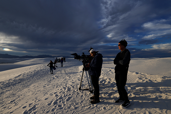 Crew filming in snowy terrain