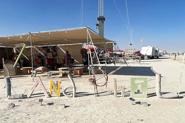 "Land Phil" spelled out by random material at Burning Man