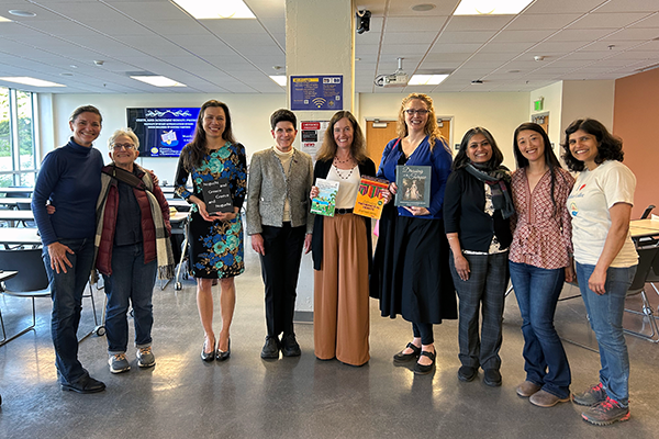 Seven SF State faculty and staff members holding their books to take a picture