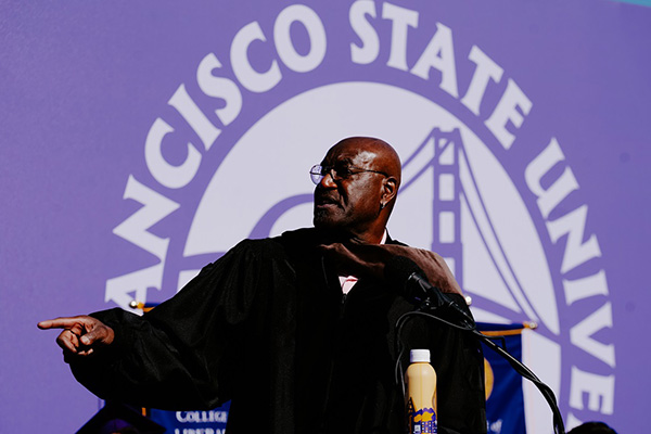 Delroy Lindo gestures during commencement speech