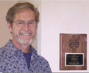 Douglas Brown smiles at the camera.