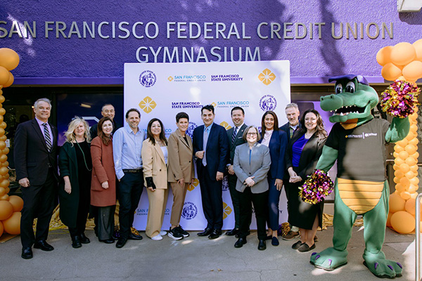 SFSU and San Francisco Federal Credit Union partners pose together at the gymnasium renaming celebration.