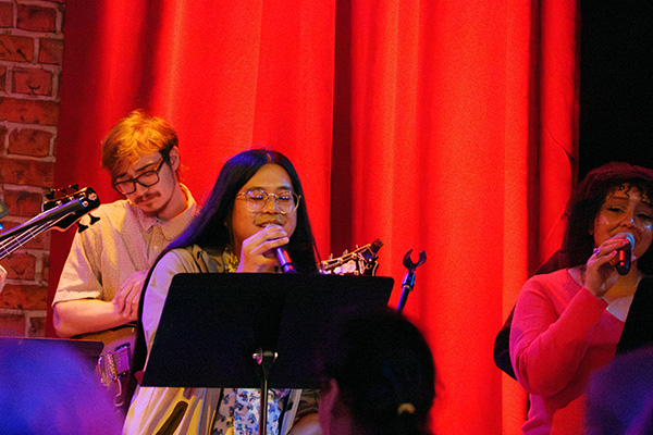 Jazz performer singing on stage