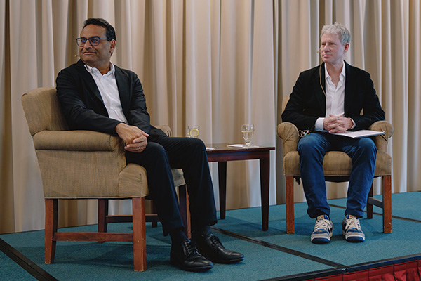 Former Starbucks CEO on stage for a sit down interview with Lam Larsen