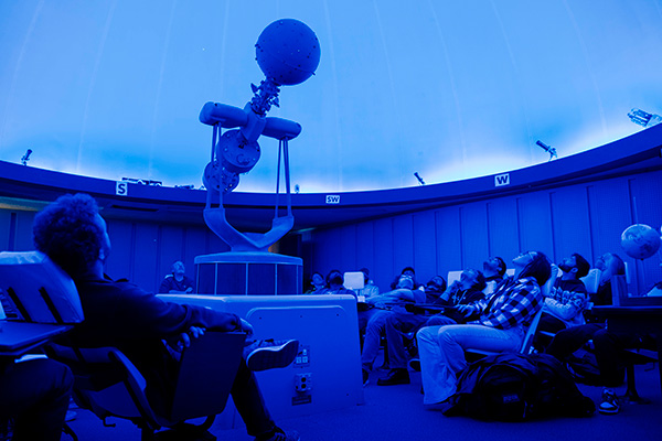 Planetarium room under blue mood lighting
