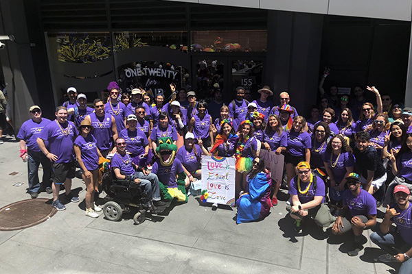 a group of smiling students, staff and faculty at SF Pride Celebration