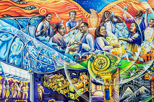 Incarceration to Liberation/De la Encarcelación a la Liberación’ mural by Juana Alicia in the Cesar Chavez Student Center