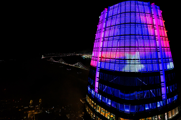 A video artwork by SFSU students illuminates the top of Salesforce Tower.