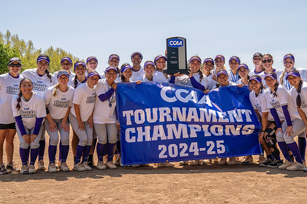 04-05 SFSU softball celebrate their CCAA Tournament Championship with banner