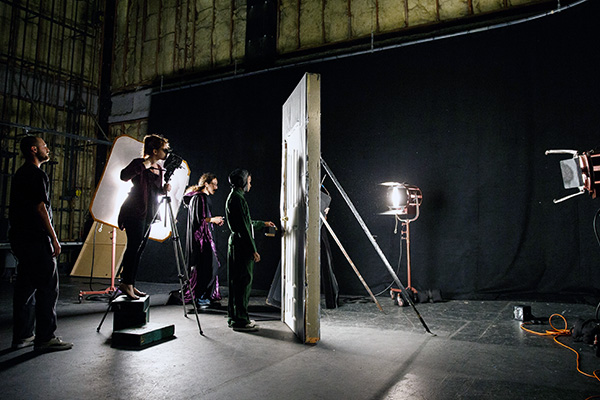 students filming a scene on a soundstage