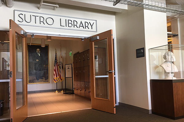 Sutro Library entrance with Adolph Sutro bust and large portrait.
