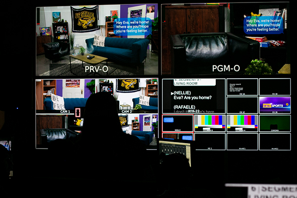 Student managing four broadcasting screens