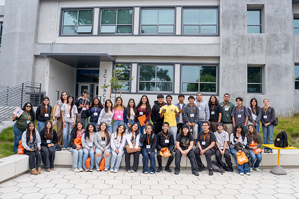 A group of Bay Area students pose together outside the SFSU science building during the College Access Summit.